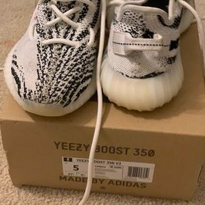 Zebra Yeezy’s, slightly used, size 5. In very good condition and authentic.